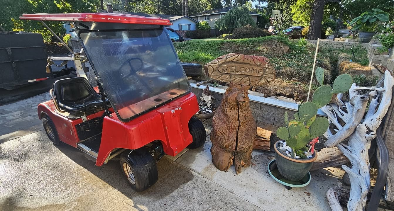 Picked up a golf cart and a hand carved wood bear haha…
